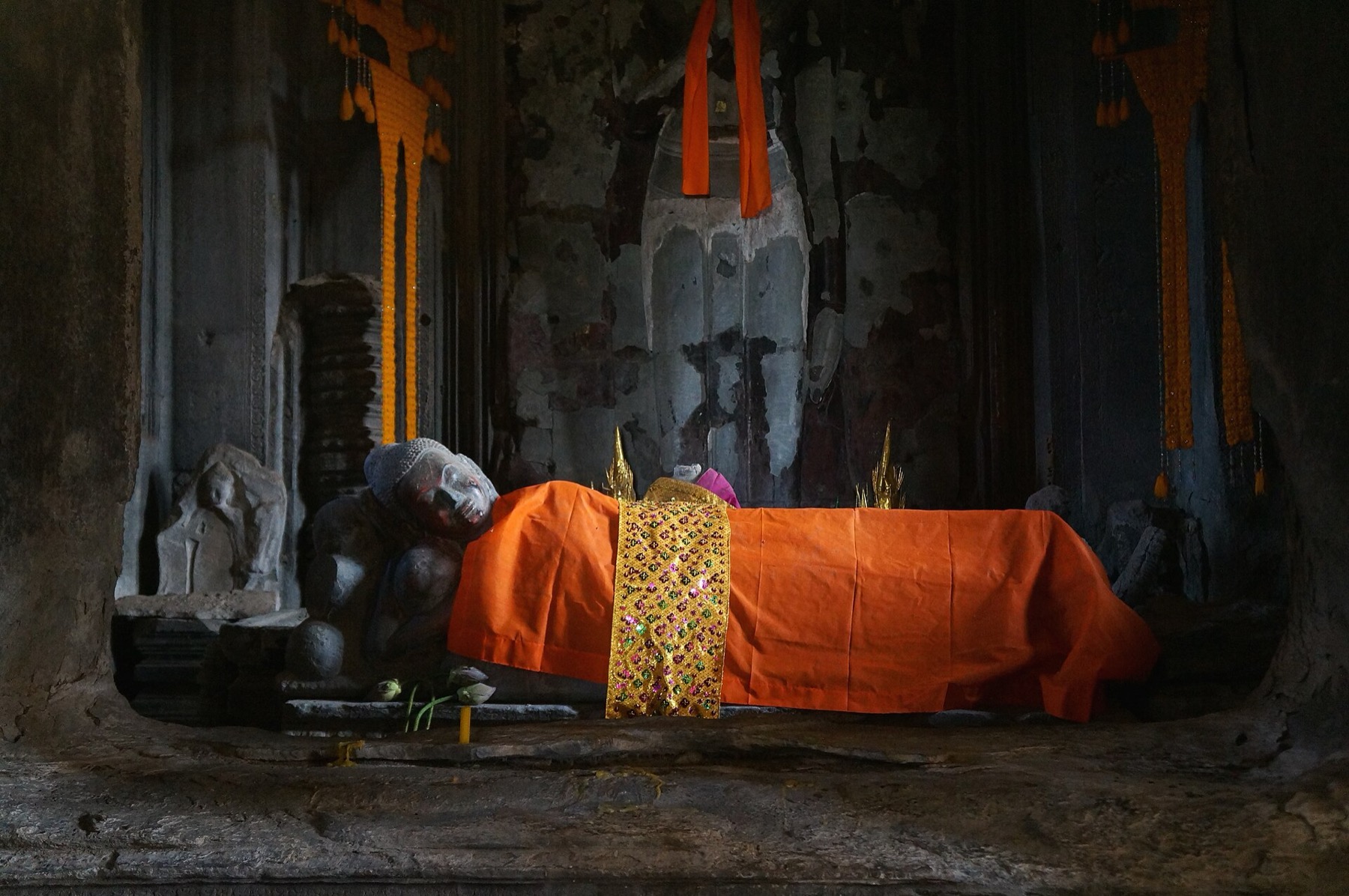 The central towers of Angkor Wat reflected at dawn