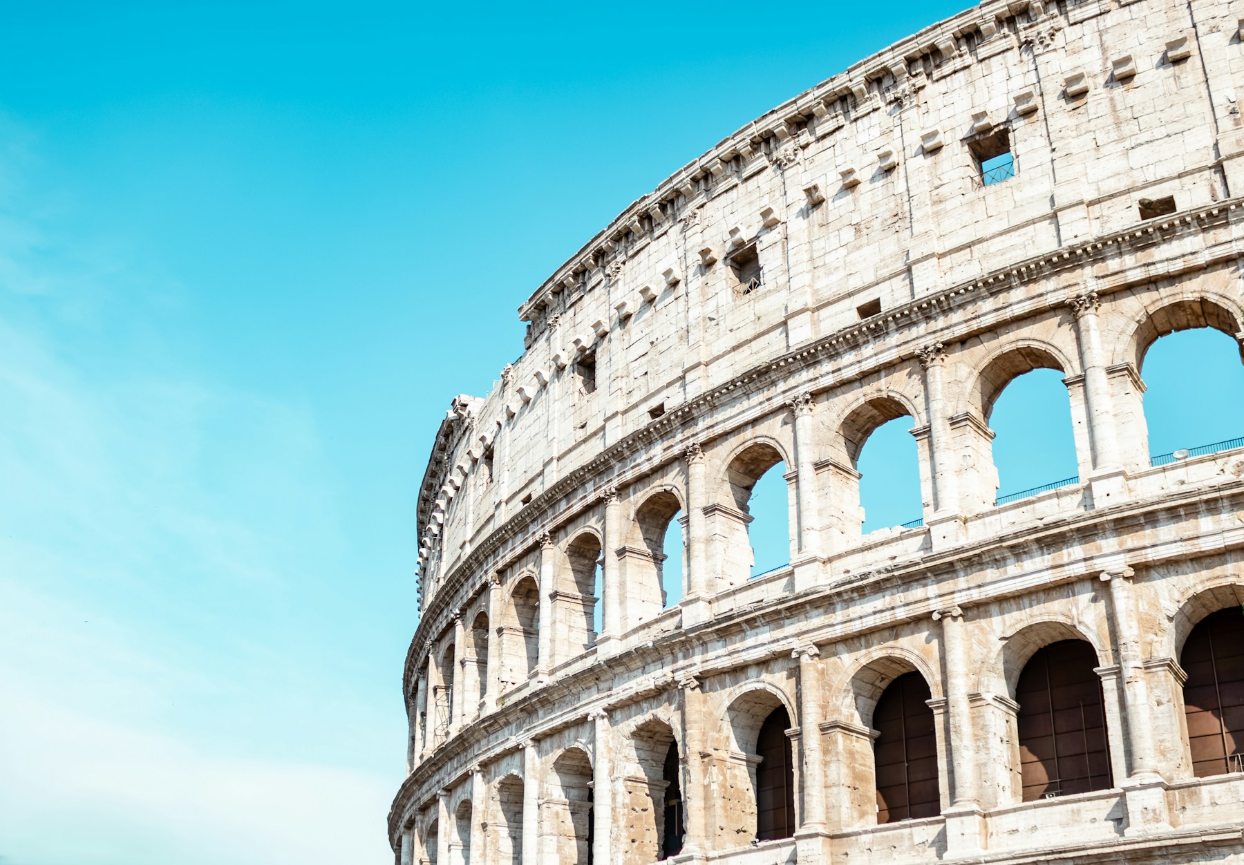 The repeating stone arches of the Colosseum in Rome