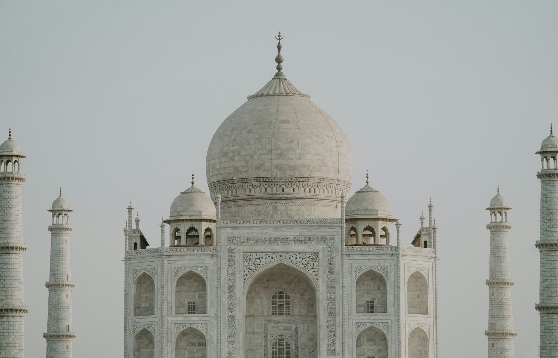 The white marble domes and minarets of the Taj Mahal